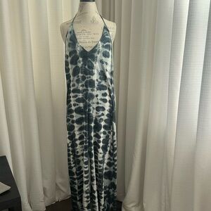 Jumper ankle length/halter with low back and built in bra. Size Medium